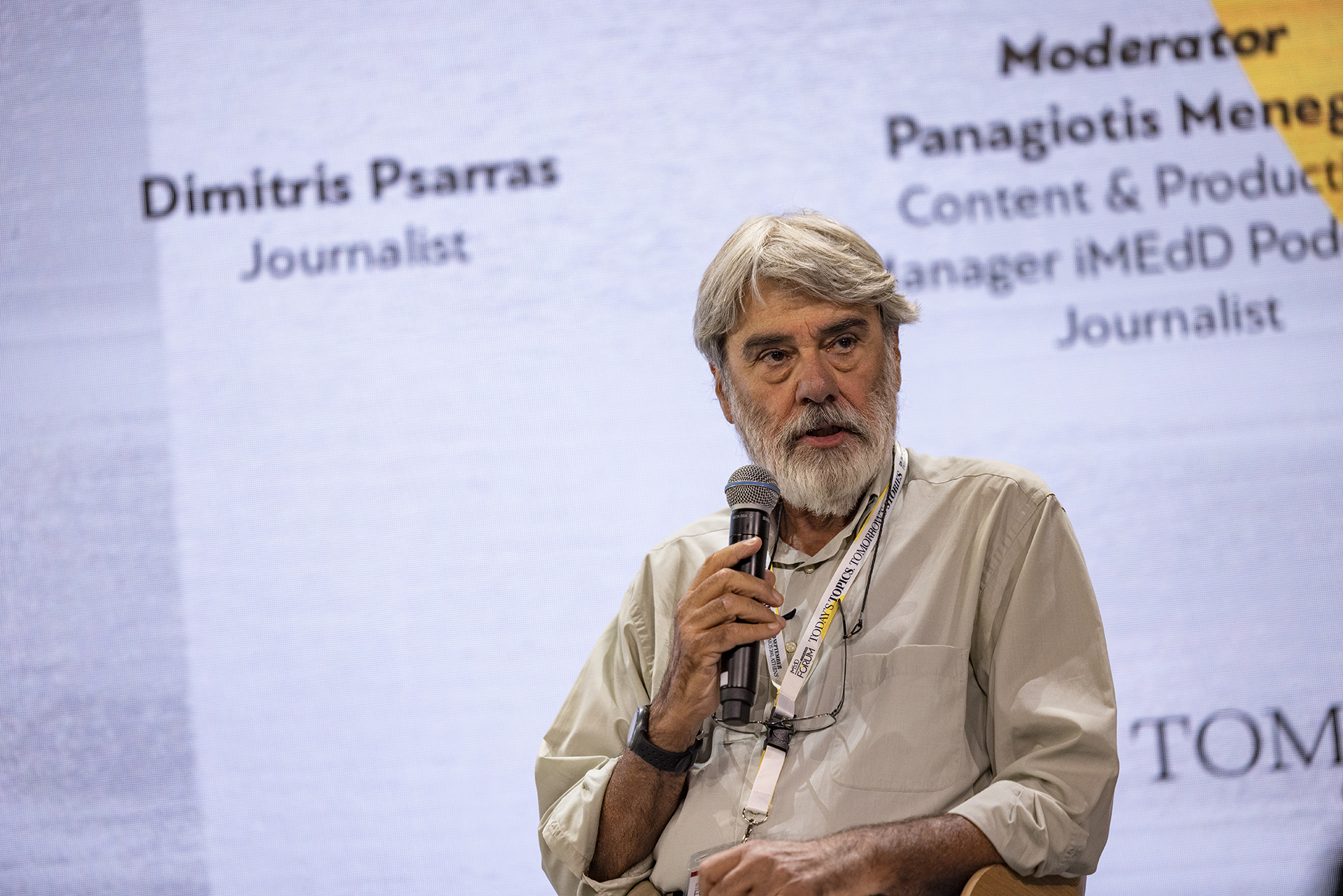 Dimitris Psarras, a journalist of the newspaper "Efimerida ton Syntakton", speaks holding a microphone, as part of the panel "We need to talk about the far right, but how?", held at the iMEdD International Journalism Forum in September 2023. 