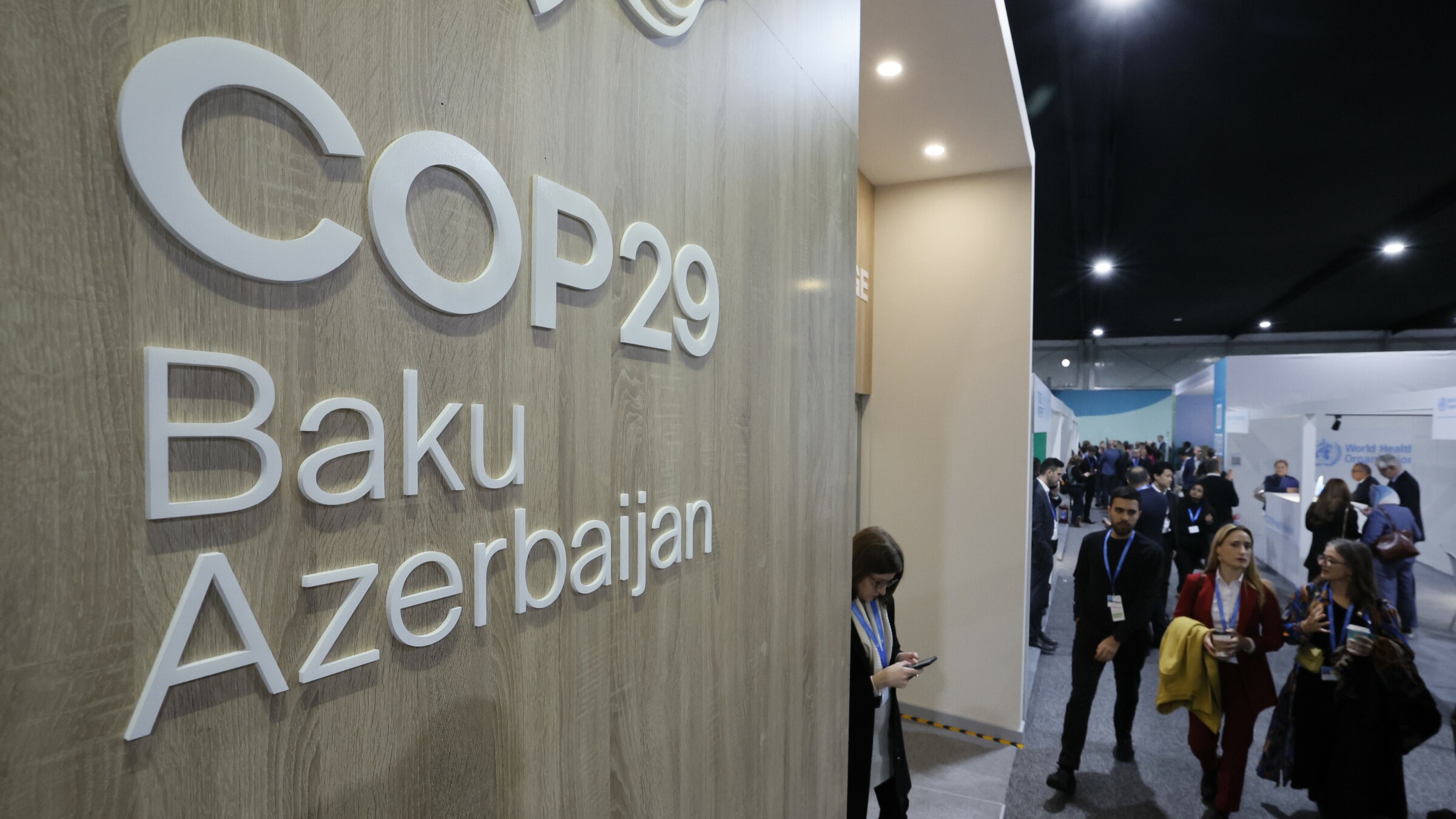 Sign that reads "COP29 Baku Azerbaijan" on a wooden surface, located at one of the areas of the conference venue in Baku, Azerbaijan.